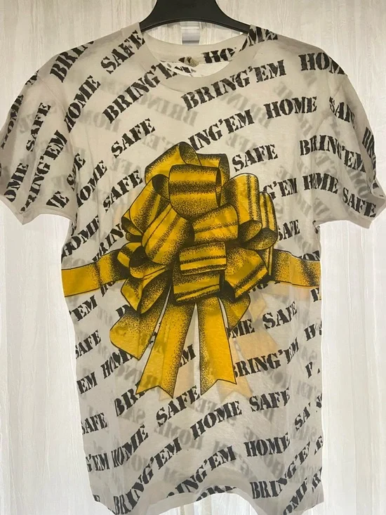 Vintage Screen Stars AOP “Bring’Em Home Safe” White Tee with Yellow Bow Graphic - Picture 2 of 4